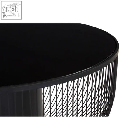Black glass top round coffee table with sleek matte black cylindrical wireframe base trento coffee table