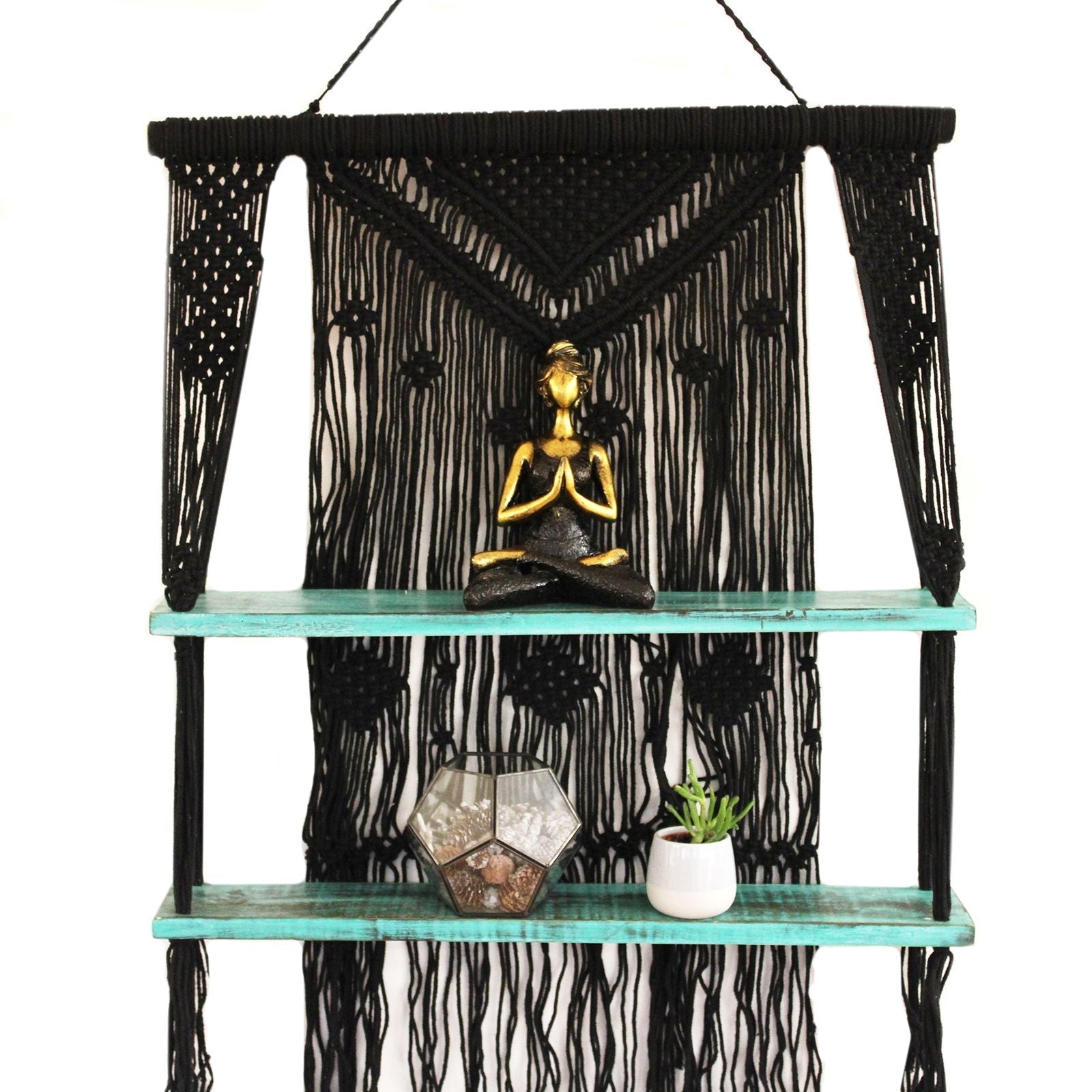 Black macrame hanging shelves with turquoise shelves holding golden buddha statue and plants perfect gift idea