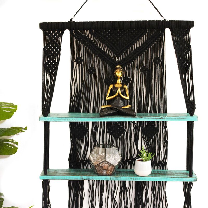 Black macrame hanging shelves with two turquoise shelves holding decor perfect macrame hanging gift idea