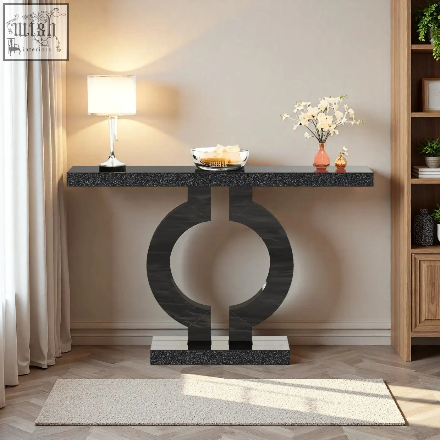 Modern black marble console table with sleek circular base perfect as a sculptural entryway or sofa table