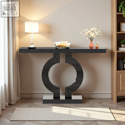 Modern black marble console table with sleek circular base perfect as a sculptural entryway or sofa table