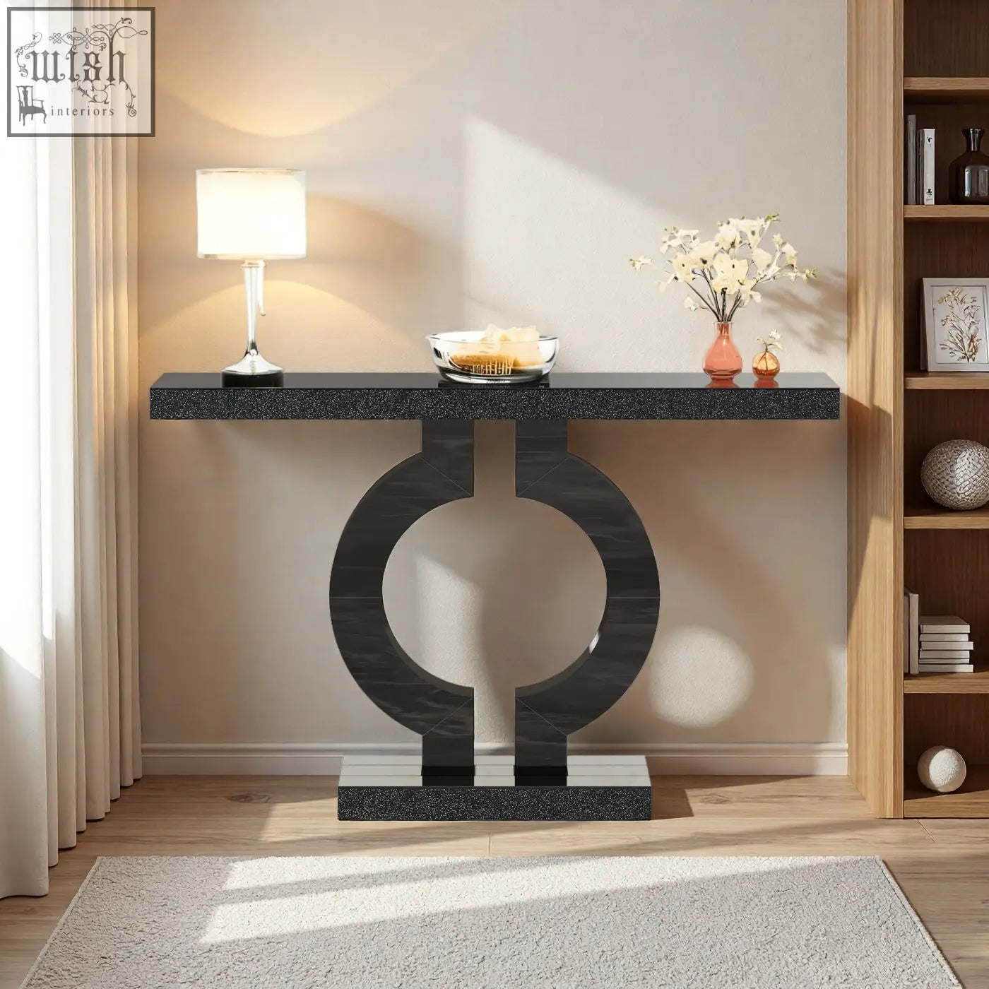 Black marble-effect modern console table with sleek circular base perfect as a sculptural entryway or sofa table