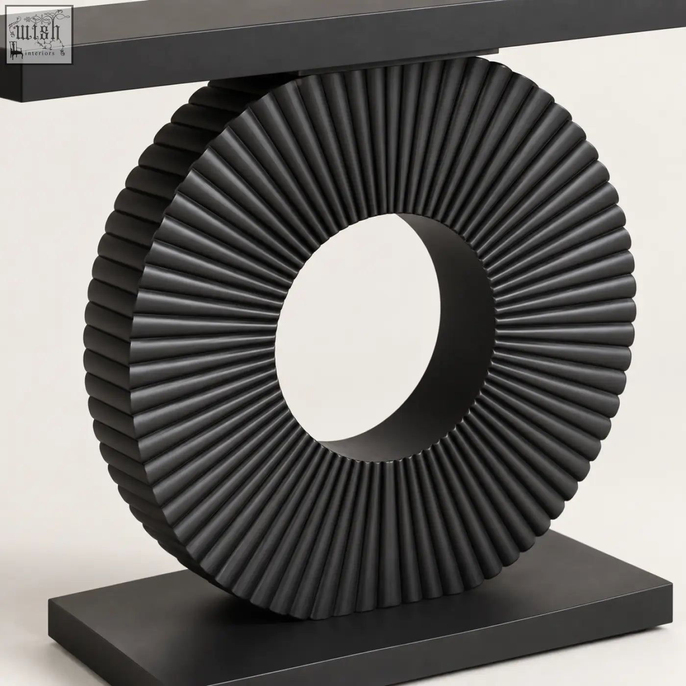 Black sculptural fluted console table with ribbed circular design in sleek modern style for stylish living spaces