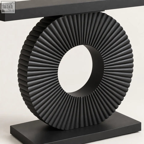 Black sculptural fluted console table with ribbed circular design in sleek modern style for stylish living spaces