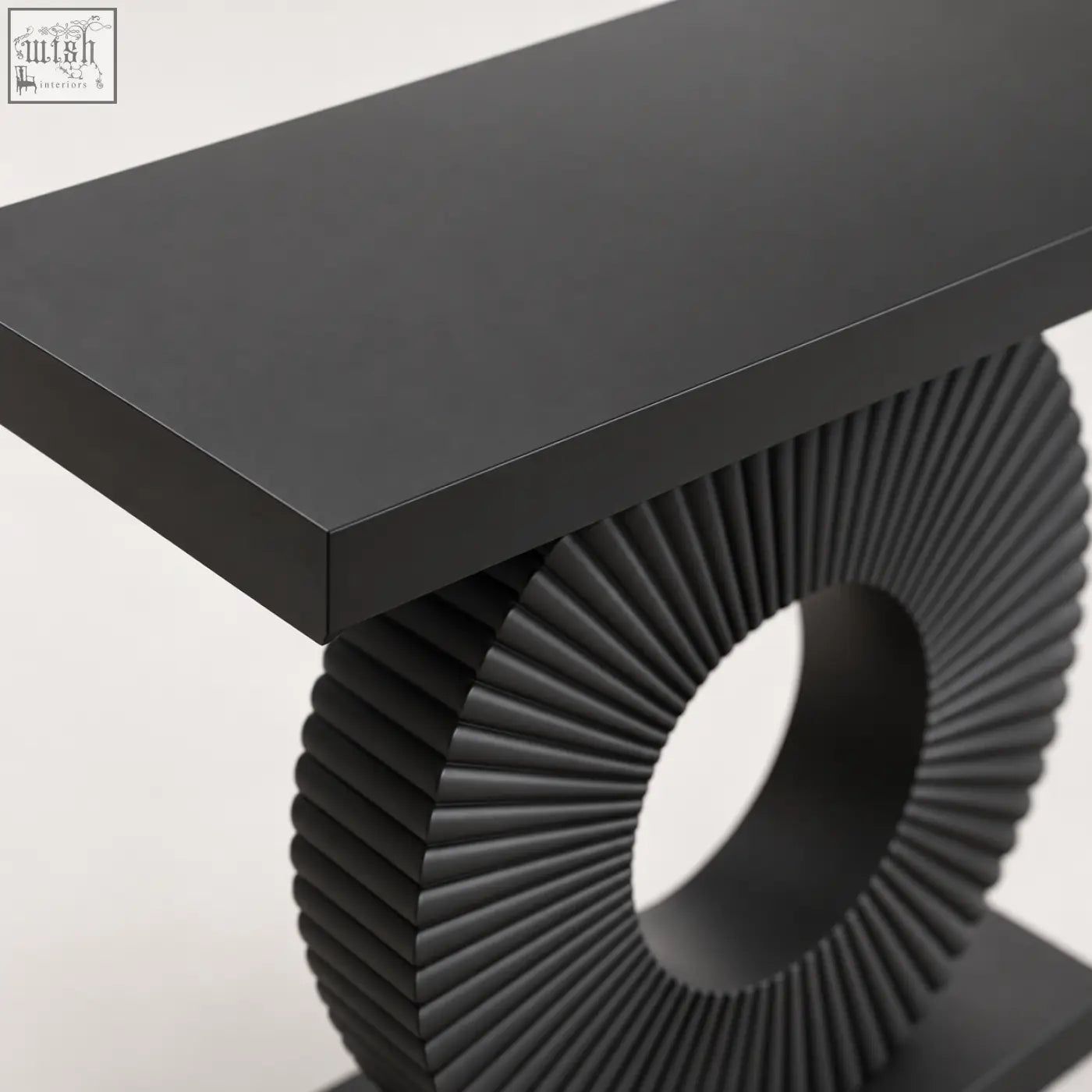 Black sculptural fluted console table with a matte top and a circular fluted base for stylish living spaces