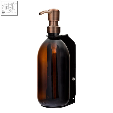 Black single wall mounted soap dispenser with amber refillable glass bottle and brushed copper stainless steel pump