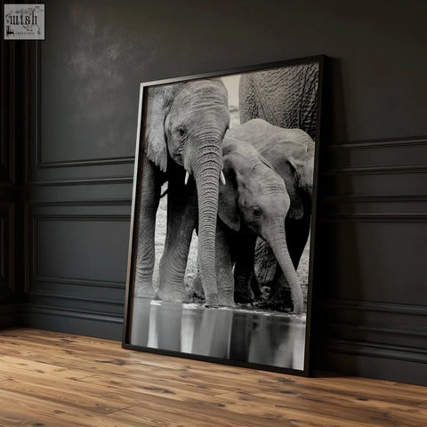Black white photography print of elephants near water in a black frame from african wildlife wall art set of 3