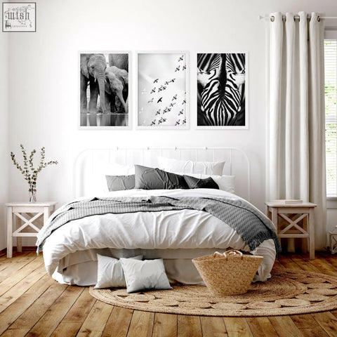 Woven natural fiber basket with handle shown beside black white photography prints of african wildlife set of 3