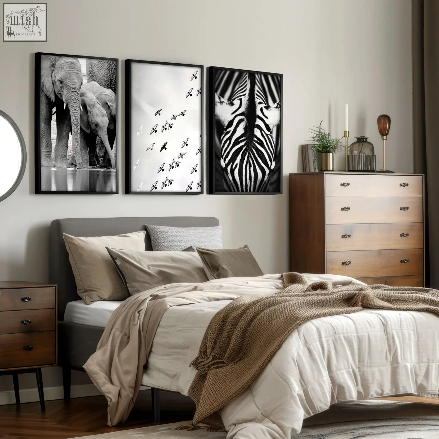 Three black-framed wall art pieces with black white photography prints of african wildlife elephants zebra and birds