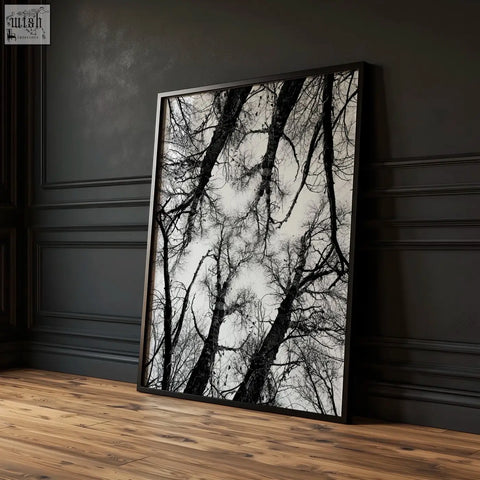 Black white photography print featuring a black-framed high-contrast photo of bare tree branches in winter nature