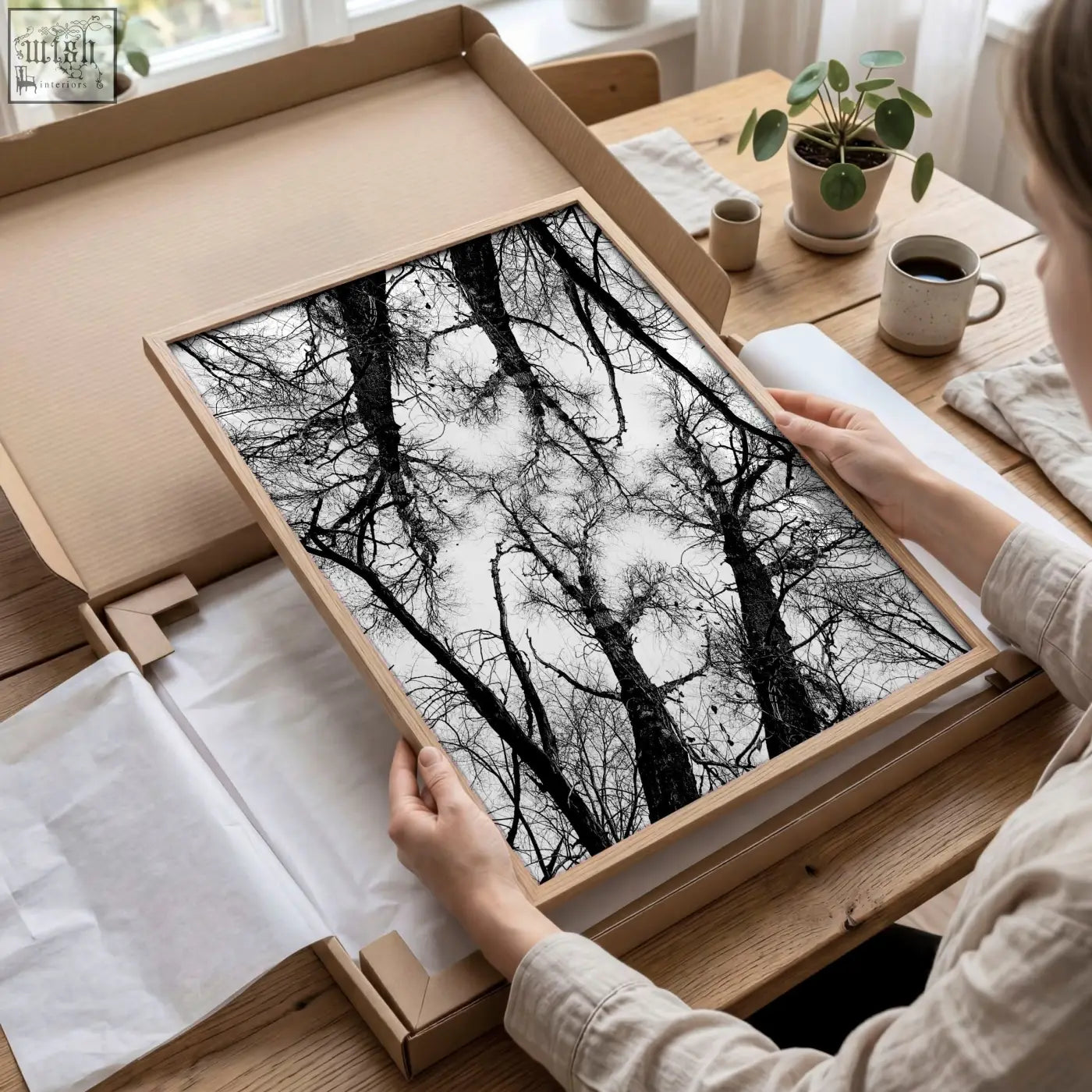 Minimalist black white photography print of tree silhouettes in a light wood frame perfect for winter nature wall art