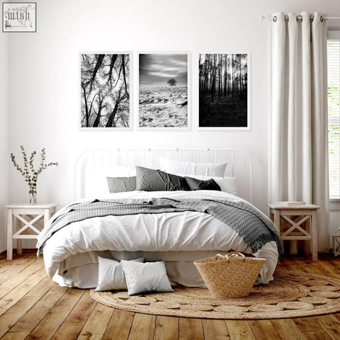 Woven natural fiber basket with handle next to black white photography winter nature landscape wall art prints set of 3