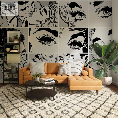 Tan leather sectional sofa with tufted cushions and wooden legs in a living space with contact clickwalls pop art wallpaper