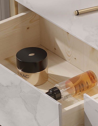 Gold and black compact powder in sleek minimalist design on blakely dressing table with gold leg and marble effect