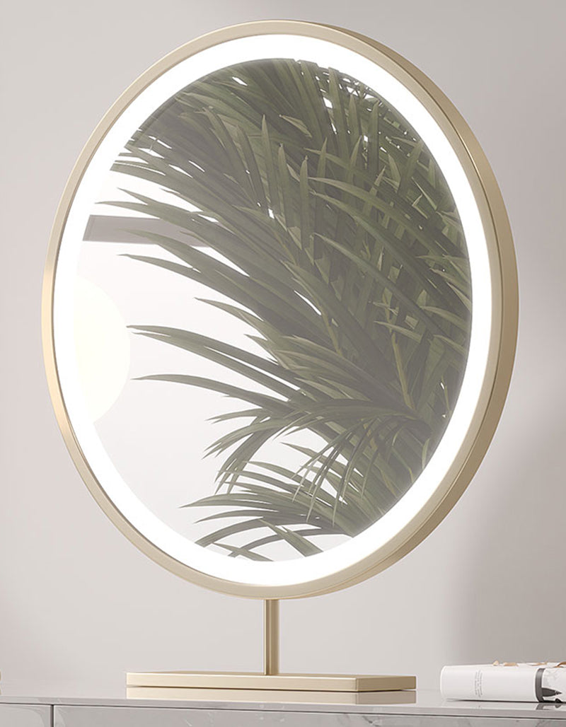 Circular vanity mirror with sleek gold-toned metal frame and led ring on blakely dressing table with marble effect
