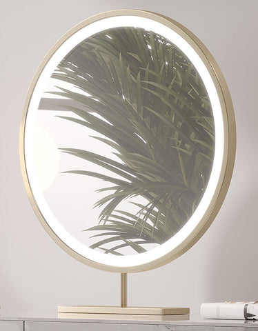 Circular vanity mirror with sleek gold-toned metal frame and led ring on blakely dressing table with marble effect