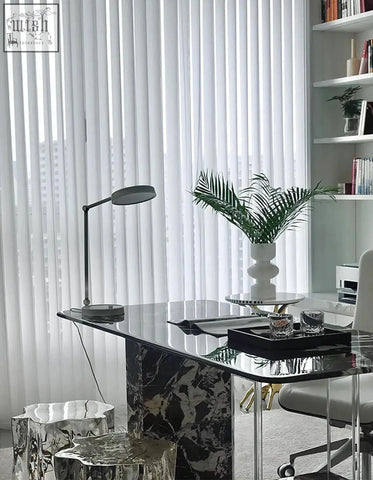 A sleek blanchard office desk with a black marble top, acrylic glass surface, and metallic legs in art deco style