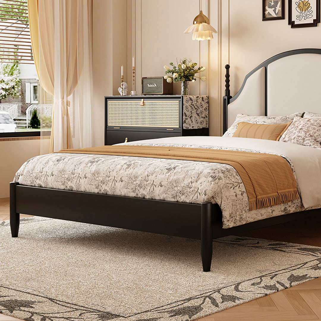 Black metal bed frame with curved headboard and tapered legs in blanche king size and super king size options