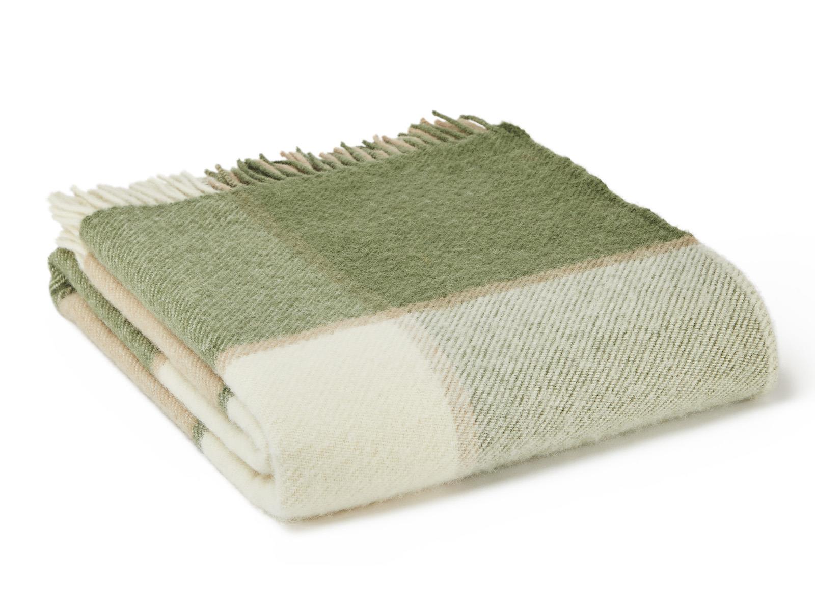 Folded block check wool throw in olive with green and cream checks and fringed edges made from pure new wool