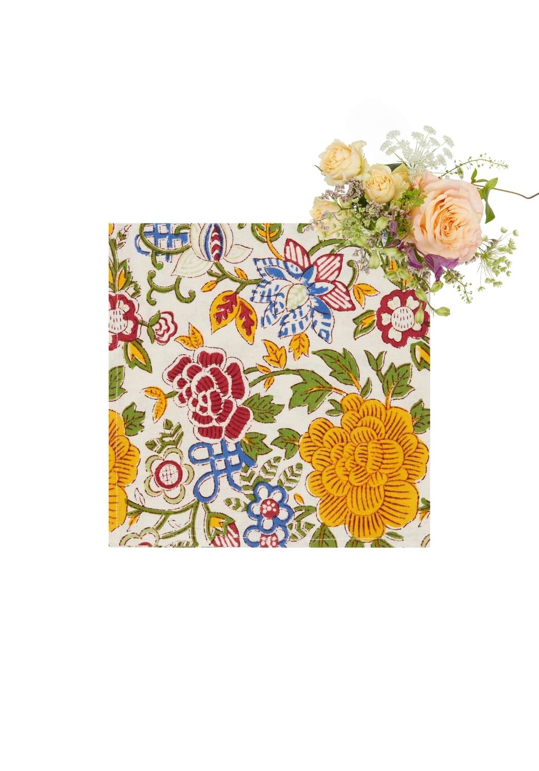 A square blooming spring table napkin set of 4 with vibrant floral pattern in reds yellows blues and greens on off white