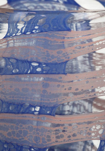 A translucent glass candle holder vase with flowing blue and peach marbled patterns called blue affect
