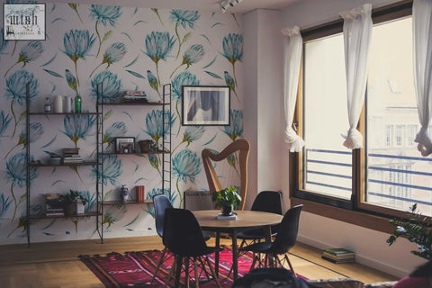A wooden harp with an elegant curved design sits by blue flowers removable wallpaper creating a cozy living space