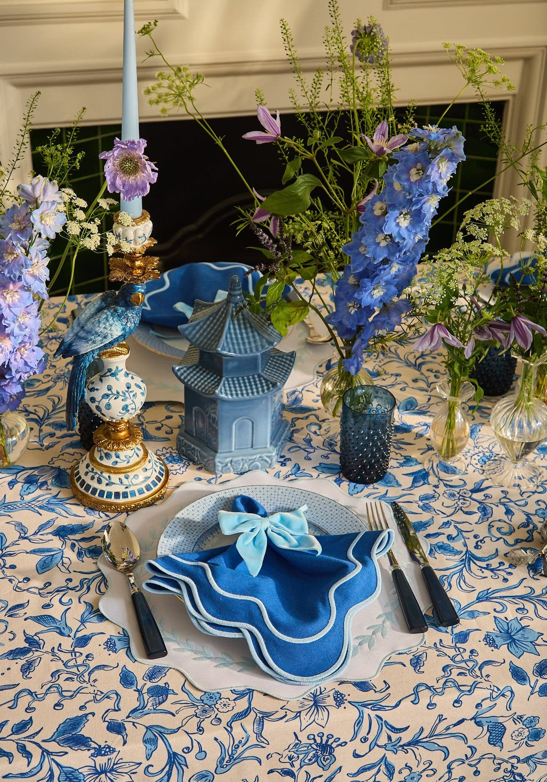 Blue garland placemats set of 4 with blue napkin featuring light blue bow scalloped edges and white embroidered border