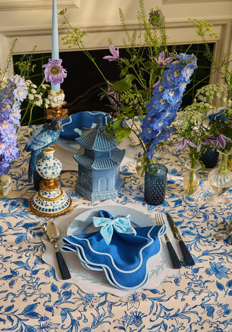 Blue garland placemats set of 4 with blue napkin featuring light blue bow scalloped edges and white embroidered border