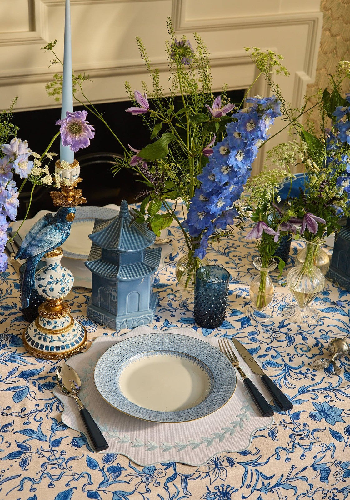 Blue garland placemats set of 4 with blue and white patterned ceramic plate and delicate scalloped edge design