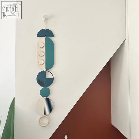 Teal and cream geometric modern wall art with wooden circles half moons and striped accents for minimal decor