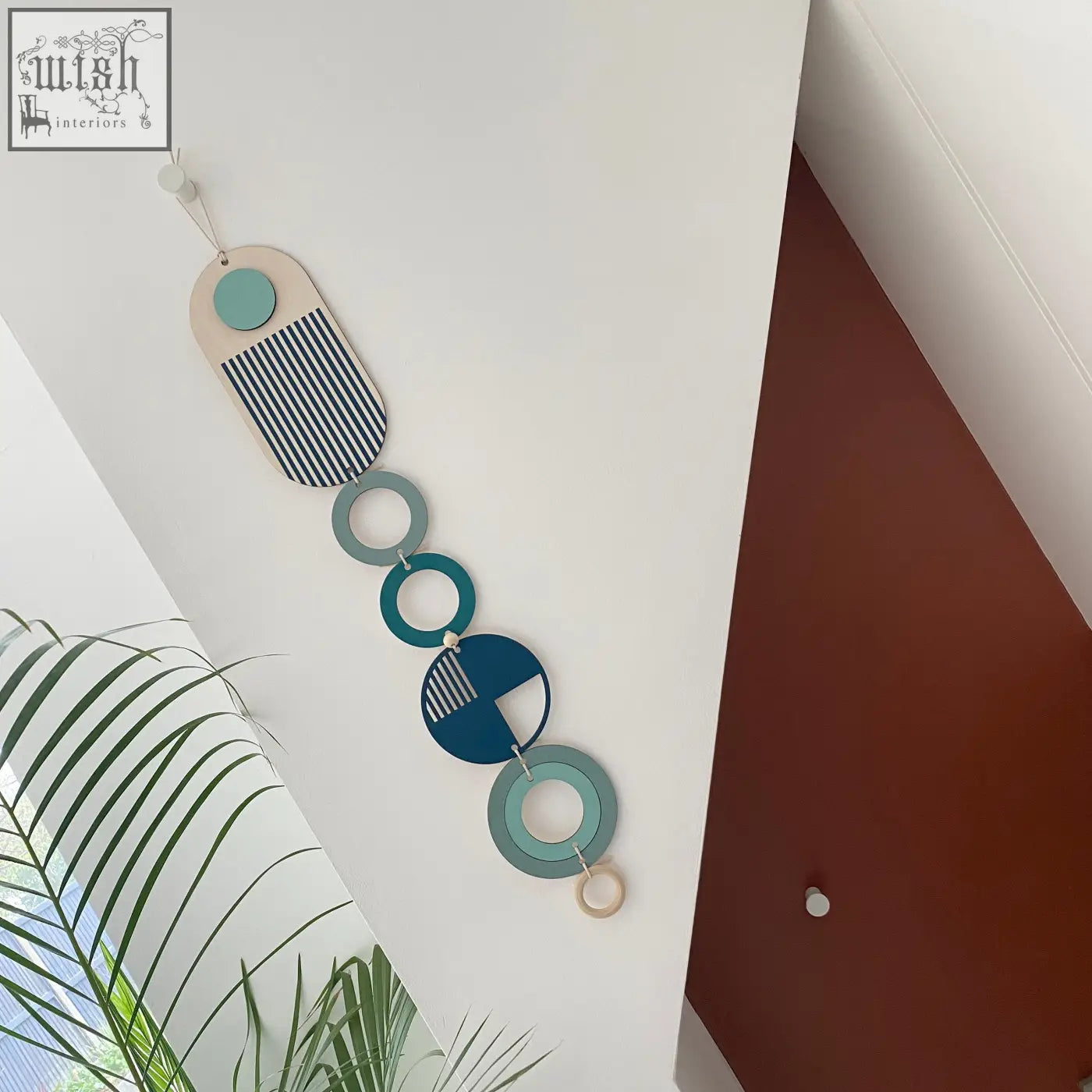 Modern wall art featuring layered teal, navy, cream, and black-and-white geometric shapes perfect for minimal decor