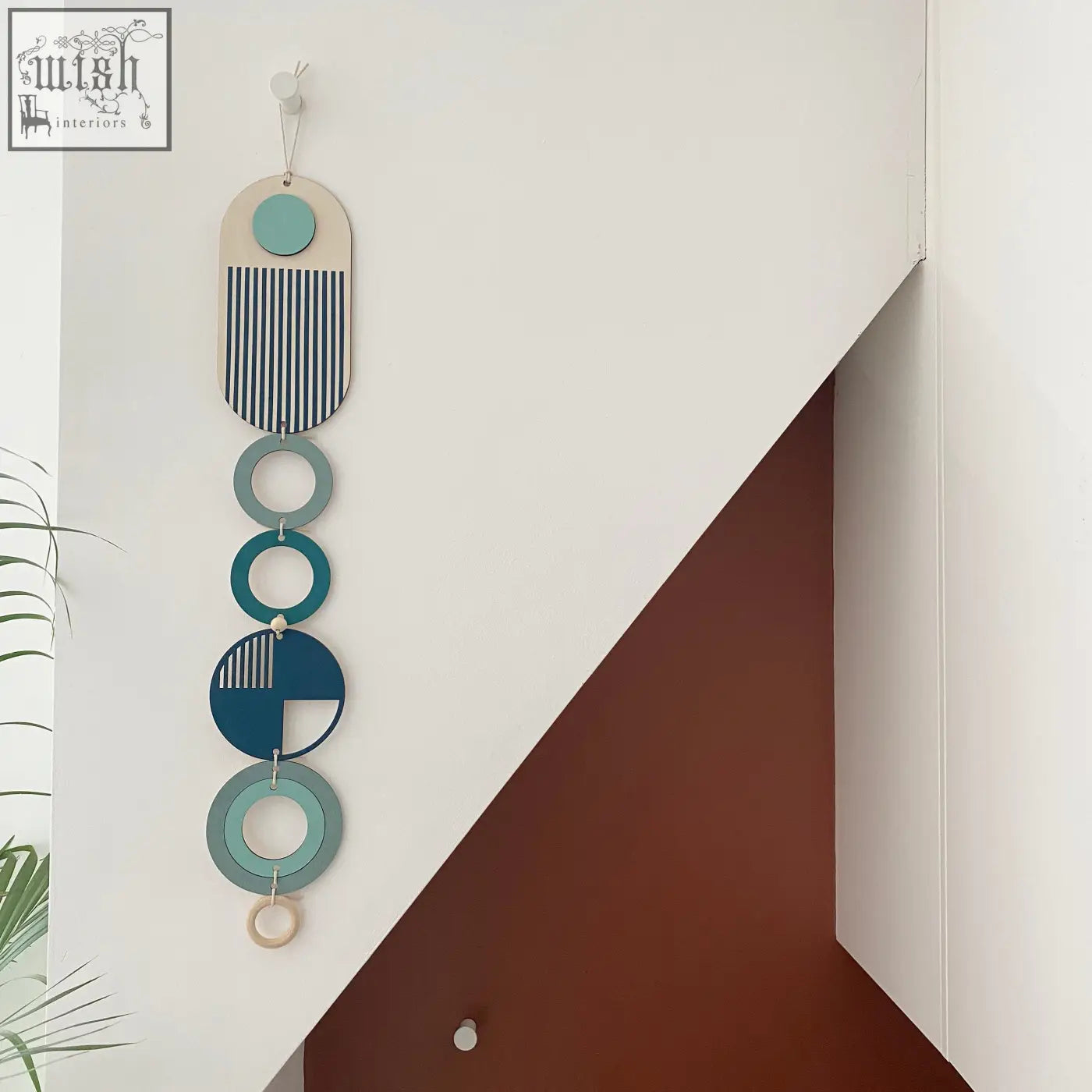 Modern wall art with teal navy blue and beige layered geometric shapes perfect for minimal home decor