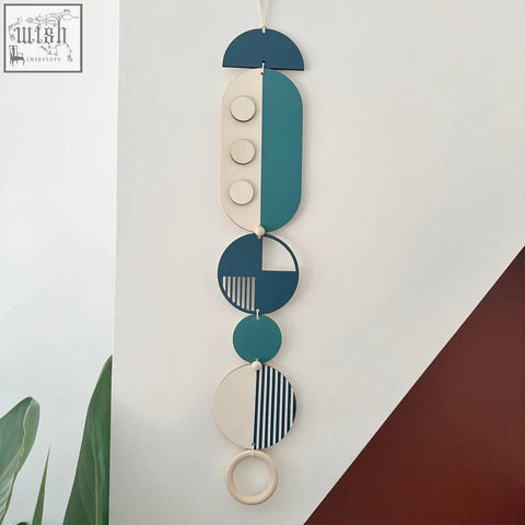 Teal and cream geometric modern wall art with wooden circles, half-moons, and a striped ring for minimal decor