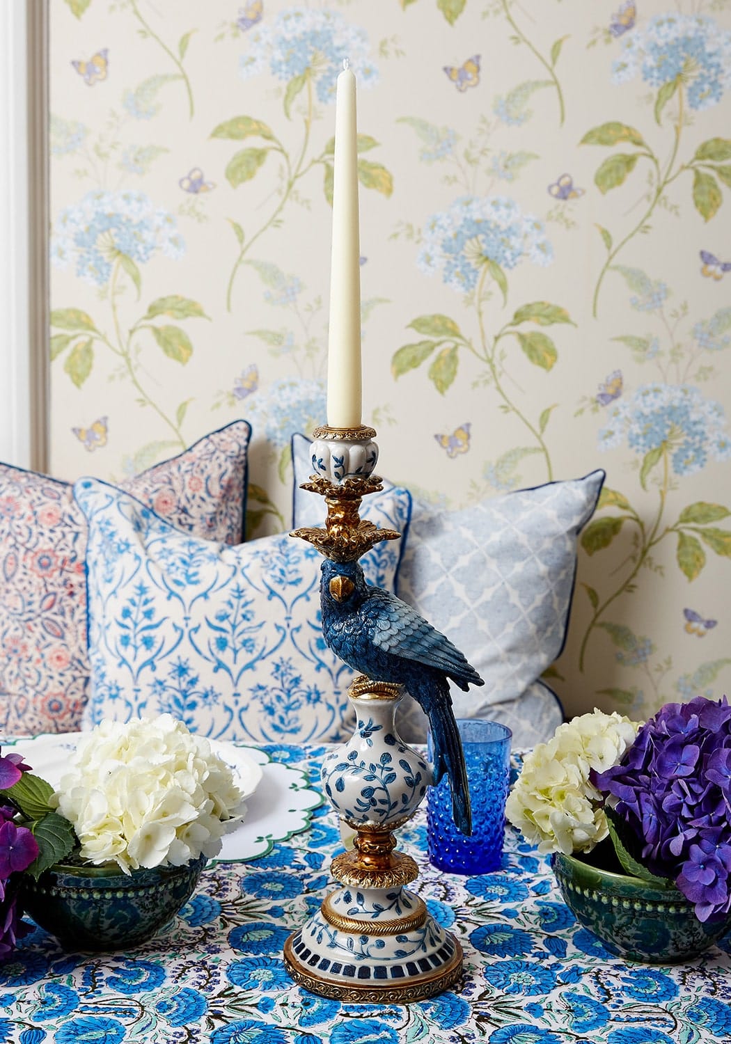 Blue and white porcelain tall candlestick with gold accents and a decorative blue parrot perched on top 40 cm tall