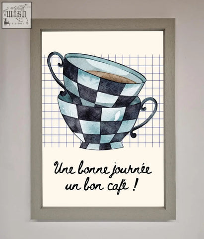 Watercolor illustration of a blue teacup stack with black and light blue checkerboard patterns in framed wall art