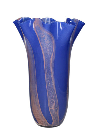 A vibrant cobalt blue glass vase with flowing pink and white swirls and a fluted scallop rim