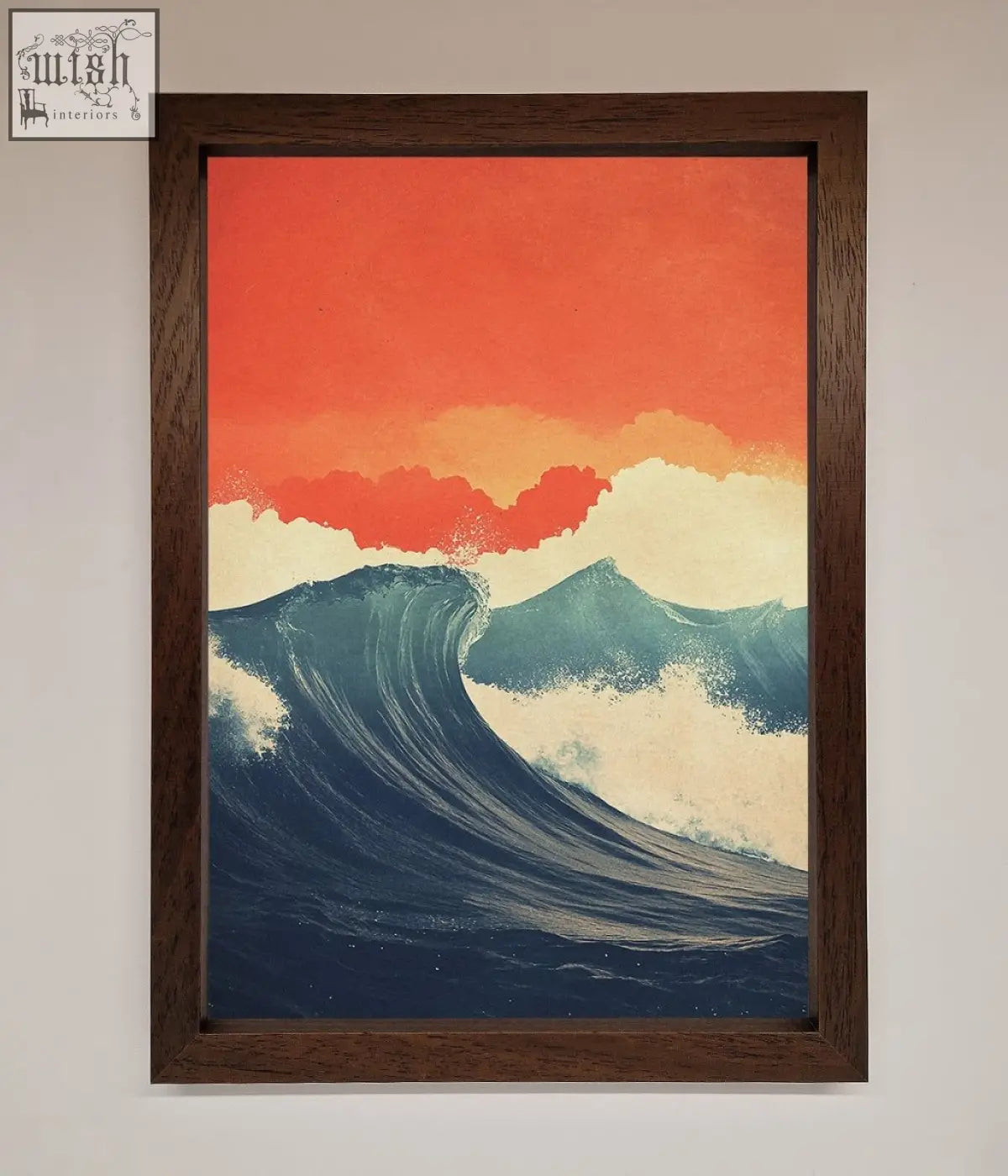 A framed poster of blue waves crash under a red sunset with a dark wood frame perfect for wall decor