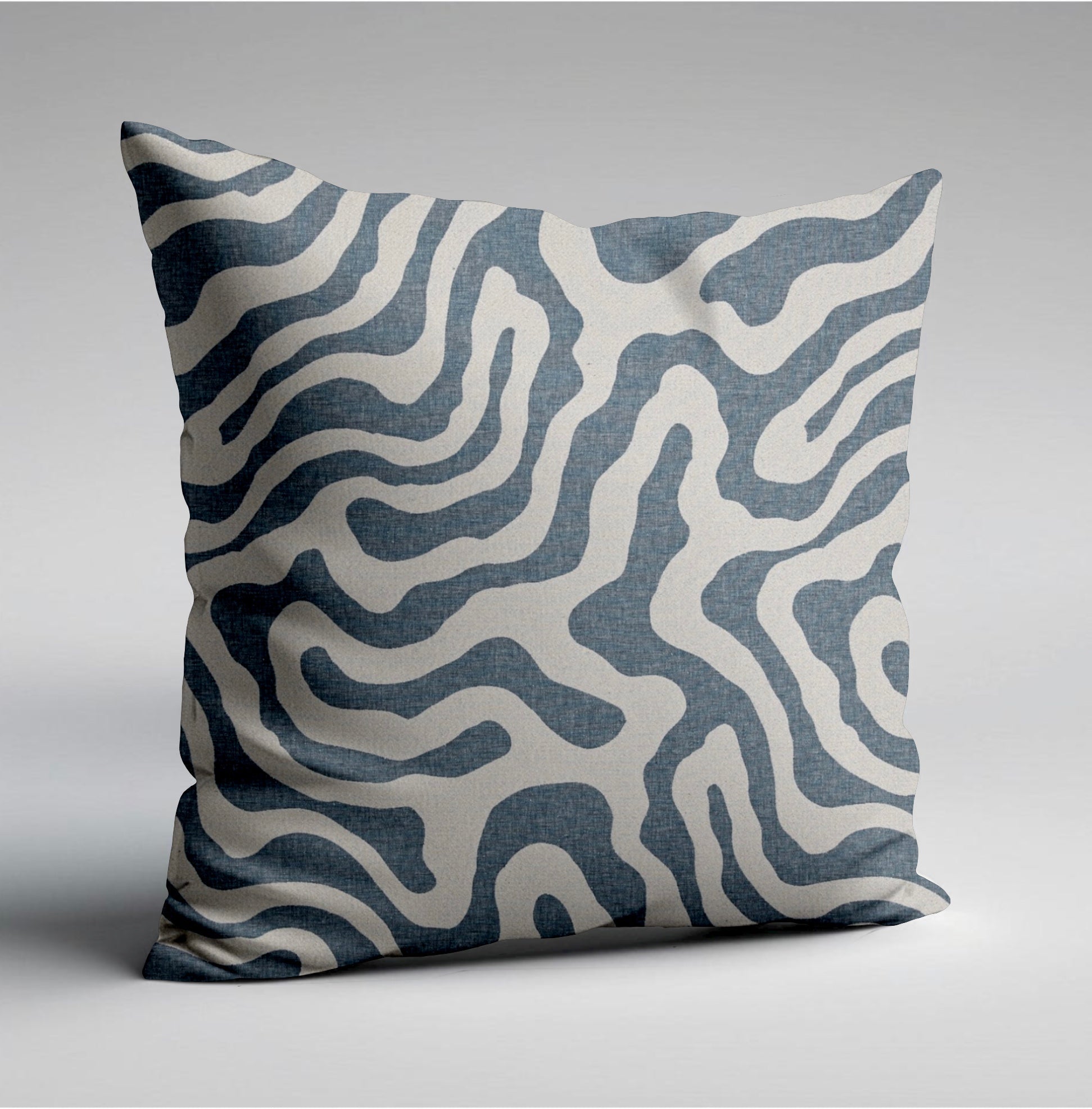 Square blue wiggle throw cushion with bold abstract white and navy wavy lines on textured fabric scatter cushion
