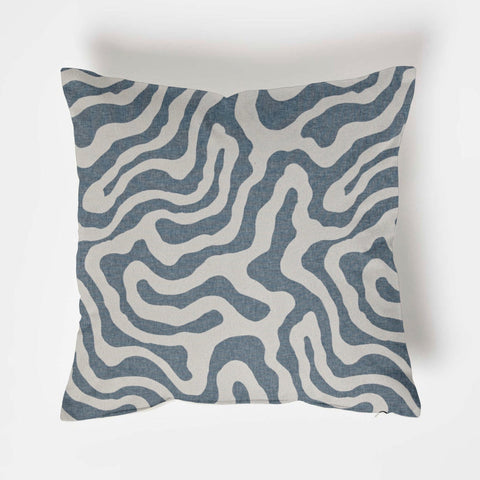Square blue wiggle throw cushion with modern abstract white lines on a textured blue fabric scatter pillow