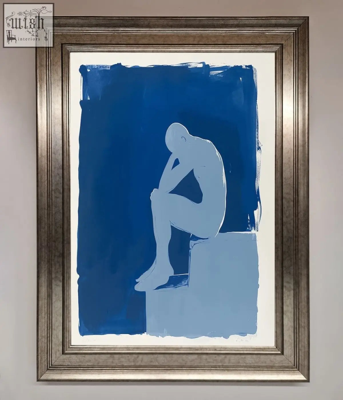 A blues thinking framed print showing a minimalist light blue seated figure silhouette on a deep blue background