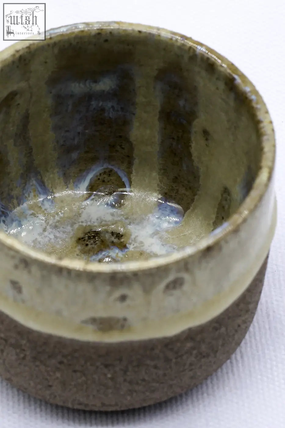 A bluverde picollo grey handmade ceramic espresso mug with a rustic brown exterior and greenish gray glazed interior