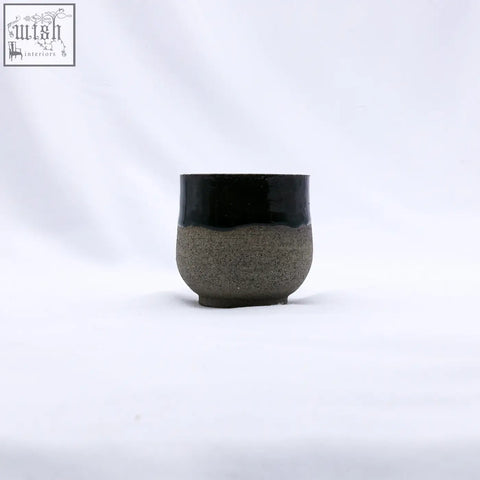 A bluverde tazza handmade ceramic smoked gray stoneware short cup with a glossy black top and matte gray bottom