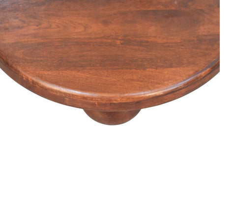Rich brown wooden Bola coffee table with smooth rounded edge and single curved leg perfect for living room use