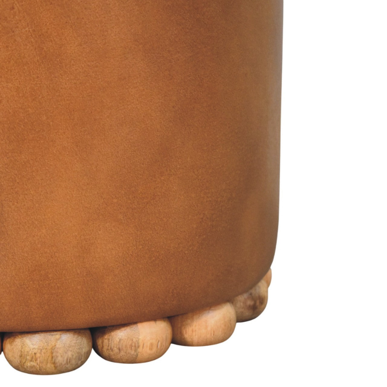 Tan bola leather stool with cylindrical shape and rounded wooden feet perfect as a stylish leather stool