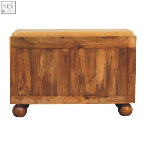 Rustic bola shoe storage bench with light brown cushioned top and rounded ball feet made of wood
