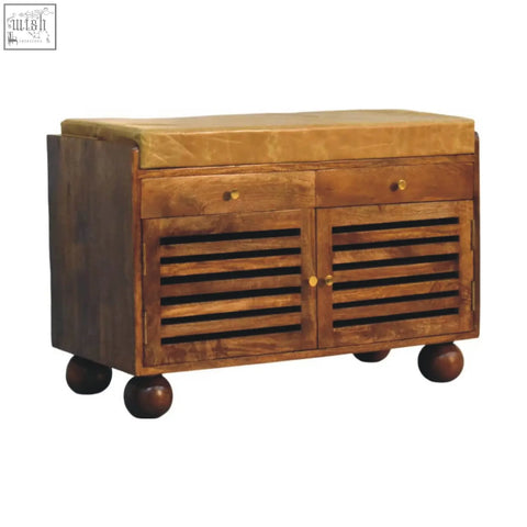 Wooden bola shoe storage bench with tan cushioned top, two drawers, slatted doors, and round ball feet