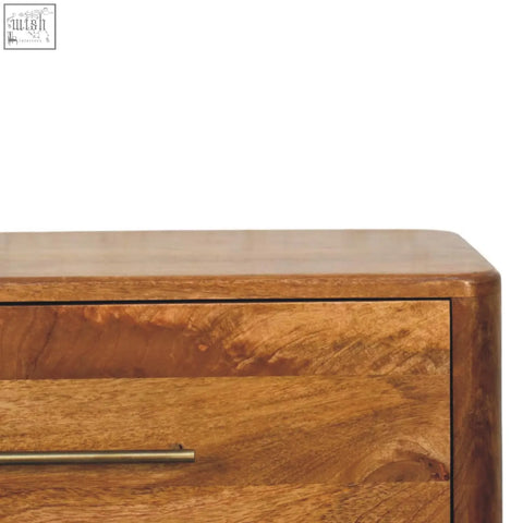 A warm-toned wooden bola three drawer chest with sleek brushed brass handles for stylish storage