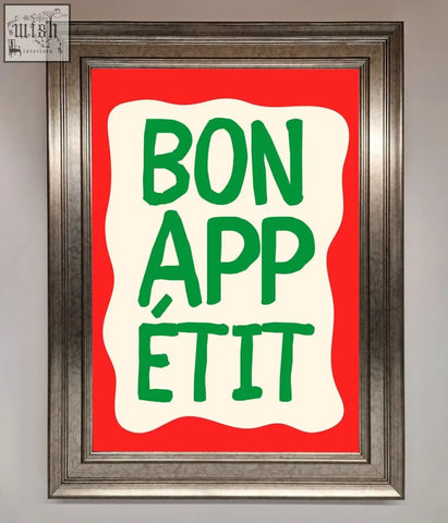 A bonappetit framed poster with bold green lettering on a cream wavy background against a bright red field