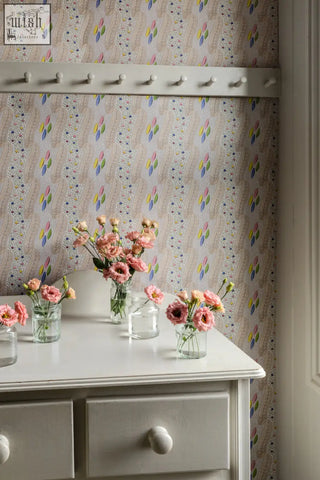 Bonbon in candy wallpaper showing a delicate pink flower arrangement in clear glass jars on a white dresser perfect for textile design and digital printing