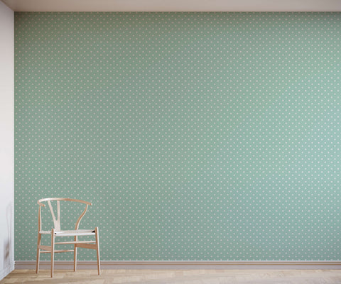 Minimalist bonbon wooden chair with white seat and y-shaped backrest against polka dot wallpaper background